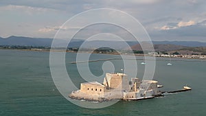 The famous Bourtzi, a Venetian water fortress at the entrance of the harbour in Nafplio seaside city in Argolis, Peloponnese,