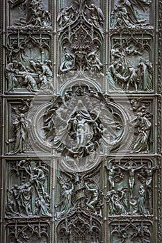 Famous bronze doors of Milan Cathedral, Italy photo