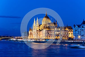 Famous Budapest parliament at the river Danube during blue hour