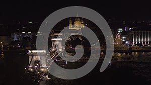 Famous building of Hungarian Parliament. Neogothic landmark in Budapest city at night. Magnificent aerial view