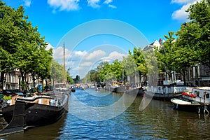 Canals and embankments with boats of Amsterdam city. photo