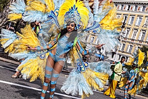 Famous Carnival of Nice, Flowers` battle. A woman in costume dancing on carnival