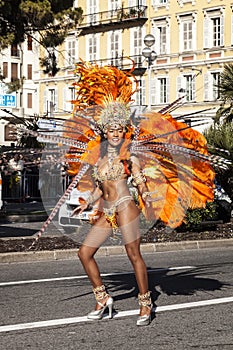 Famous Carnival of Nice, Flowers` battle. A woman in costume dancing on carnival