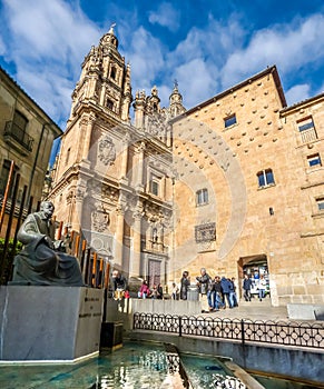 Famous Casa de las Conchas with La Clerecia Church in Salamanca,