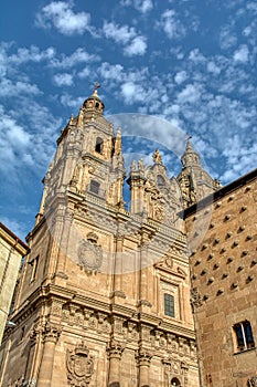 Famous Casa de las Conchas with La Clerecia Church in Salamanca, Spain photo