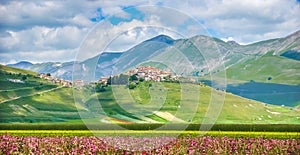 Famous Castelluccio di Norcia with beautiful summer landscape, Umbria, Italy photo