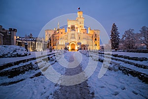 Famous castle Hluboka nad Vltavou in the Czech Republic in winter in the evening