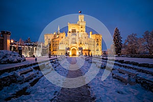 Famous castle Hluboka nad Vltavou in the Czech Republic in winter in the evening