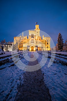 Famous castle Hluboka nad Vltavou in the Czech Republic in winter in the evening