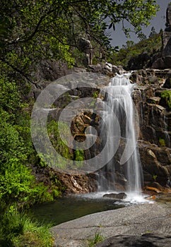 The famous `Cela Cavalos` waterfall in Geres National Park, Minho. photo