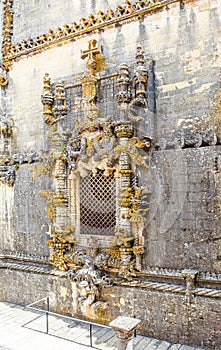 The famous chapterhouse window of the Convent of Christ in Tomar, Portugal, a well-known example of Manueline style. A World