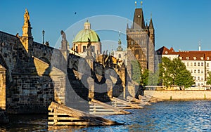 Famous Charles Bridge In Prague on a beautiful summer afternoon