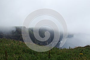 Famous Cliffs of Moher wrapped in fog