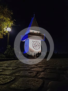 The famous Clock Tower (Grazer Uhrturm) on Shlossberg hill, Graz, Styria region, Austria, by night