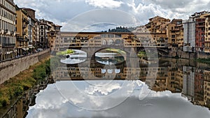 Famous Closed-spandrel arch bridge Ponte Vecchio in Florence, Italy on a gloomy day