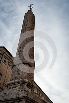 Famous egyptian obelisk in Urbino, renassance city in Italy photo