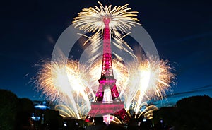 Famous Eiffel Tower and beautiful fireworks during celebrations of French national holiday - Bastille Day.