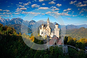 Famous fairy tale Castle in Bavaria, Neuschwanstein, Germany, morning with blue sky with white clouds