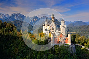 Famous fairy tale Neuschwanstein Castle in Bavaria, Germany, late afternoon with blue sky with white clouds