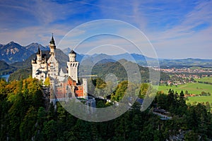 Famous fairy tale Neuschwanstein Castle in Bavaria, Germany, late afternoon with blue sky with white clouds