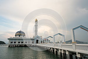 Famous floating mosque MASJID AL BADR 1000 SELAWAT with blue sky as background