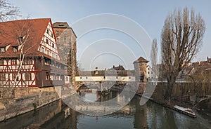 The famous Former Wine Depot Weinstadel and Water Tower Wasserturm over the river Pegnitz and  Henkersteg and Henkerhaus