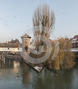 The famous Former Wine Depot Weinstadel and Water Tower Wasserturm over the river Pegnitz and  Henkersteg and Henkerhaus