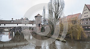 The famous Former Wine Depot Weinstadel and Water Tower Wasserturm over the river Pegnitz and  Henkersteg and Henkerhaus