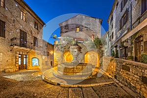 Famous fountain at dusk in Saint Paul de Vence, France