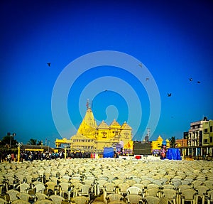 Famous full view of Somnath temple from outside. Somnath temple having lots of plastic chairs photo