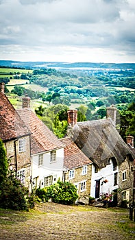 Famous Gold Hill cobbled street with old houses in Shaftesbury, UK