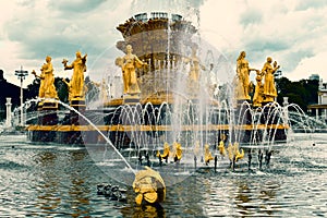Beautiful street gold fountain in the park photo