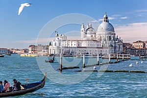 Grand Canal with gondola against Basilica Santa Maria della Salute in Venice, Italy