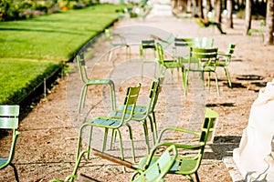 Green chairs at Tuileries gardens in Paris photo