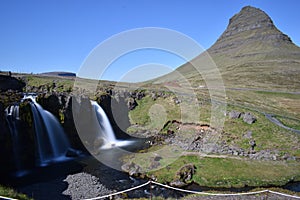 Famous kirkjufell mountain with the kirkjufell falls waterfalls in front in GrundarfjÃÆÃâÃâÃÂ¶dur in Iceland photo