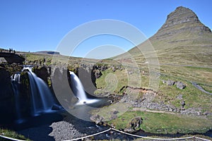Famous kirkjufell mountain with the kirkjufell falls waterfalls in front in GrundarfjÃÆÃÂ¶dur in Iceland photo