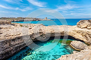 The famous Grotta della Poesia, cave with turquoise water in Puglia, Italy