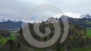 Famous Gruyere Castle in Switzerland also called Schloss Greyerz - aerial view