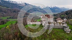 Famous Gruyere Castle in Switzerland also called Schloss Greyerz - aerial view