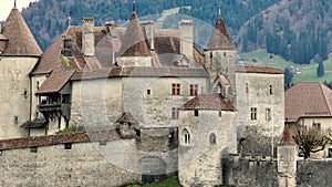 Famous Gruyere Castle in Switzerland also called Schloss Greyerz - aerial view