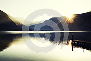 The famous Hallstatt lake - the moment of sunrise in a autumn foggy morning