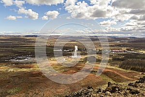 Famous Haukadalur geyser erupting on a sunny day