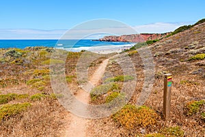 Famous hiking coast path along Rota Vicentina, Algarve landscape Portugal, near Amado Beach photo