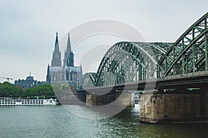 The famous Hohenzollern Bridge with the Cologne Cathedral in the background, in Cologne, Germany