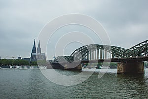 The famous Hohenzollern Bridge with the Cologne Cathedral in the background, in Cologne, Germany