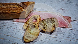 Famous homemade french jambon, ham of Ardeche region in massif central, France with traditional and authentic artisan french bread