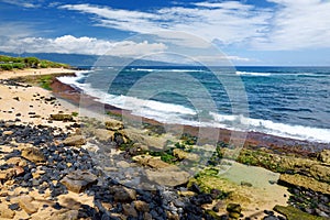 Famous Hookipa beach, popular surfing spot filled with a white sand beach, picnic areas and pavilions. Maui, Hawaii.