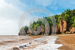 Famous Hopewell Rocks flowerpot formations at low tide photo