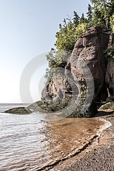 Famous Hopewell Rocks geologigal formations at low tide biggest tidal wave Fundy Bay New Brunswick Canada