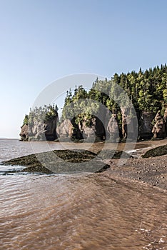 Famous Hopewell Rocks geologigal formations at low tide biggest tidal wave Fundy Bay New Brunswick Canada